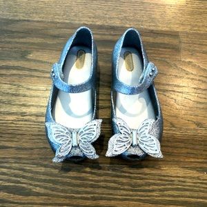 Excellent Condition Mini Melissa silver glitter butterfly Mary Janes. Size 10.